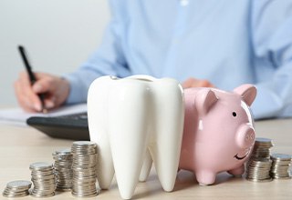 Coins next to a piggy bank