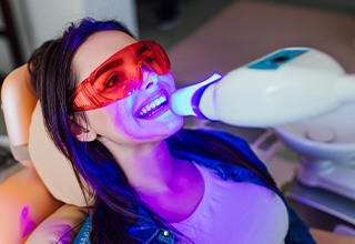 Woman having her teeth whitened