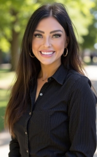 Dental patient coordinator Jaylinn in black scrubs