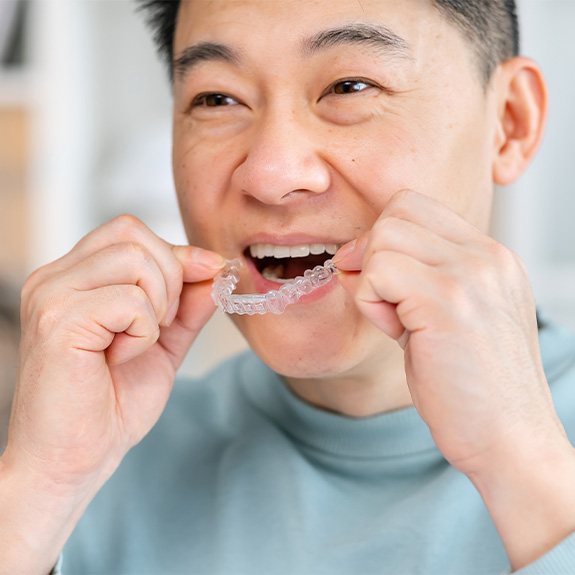 A man using Perio Protect trays to treat his gum disease