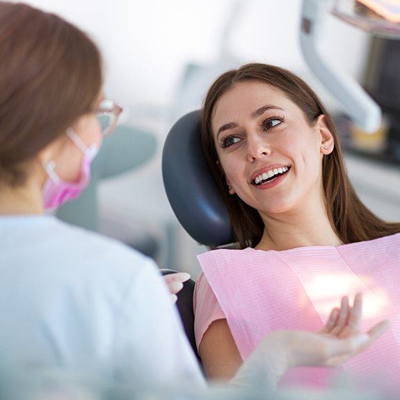 Dental patient smiling at dentist