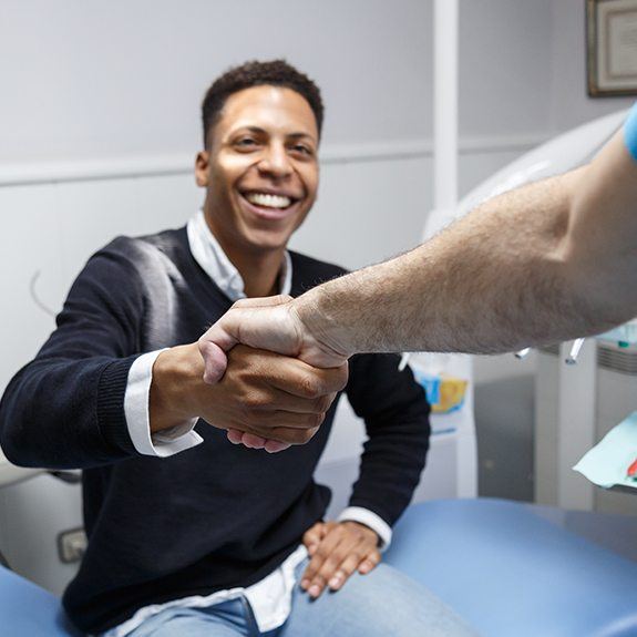 Man shaking hands with his dentist