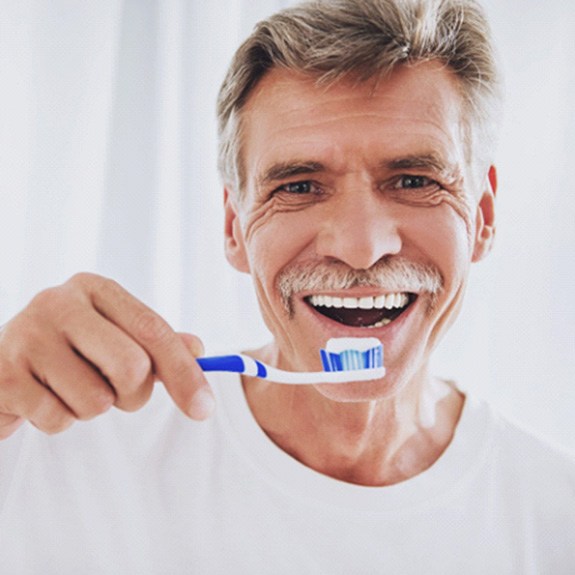 Man holding a toothbrush