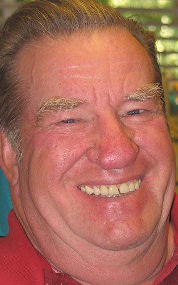 Man showing off smile after dental crown restoration