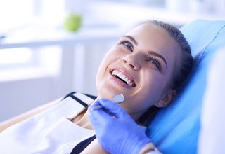 patient smiling during checkup