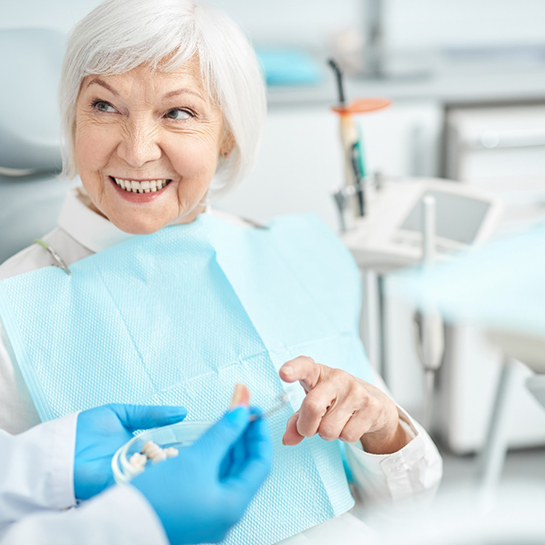 A senior lady asking questions about dentures in Weatherford