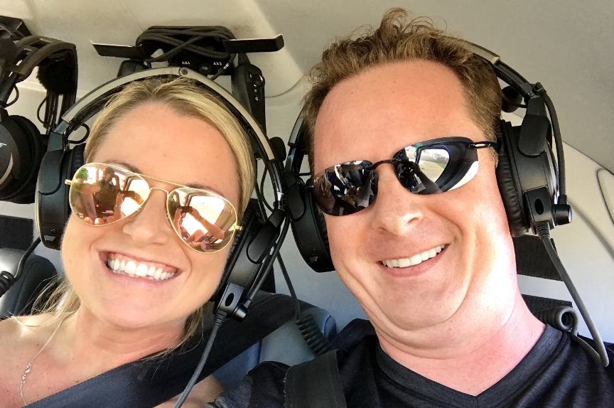 Doctor Collins with his wife and kids in a forest