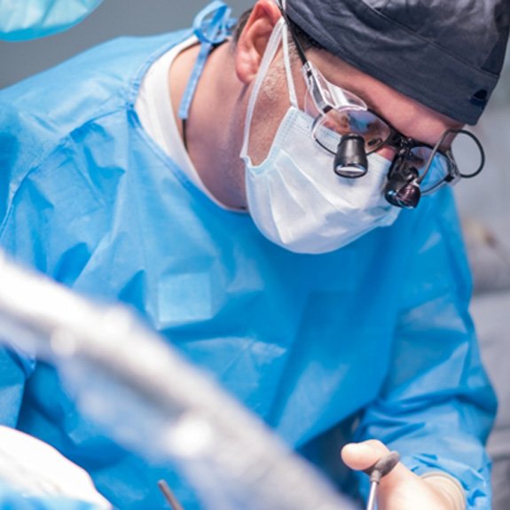 Dentist performing tooth extraction in Weatherford