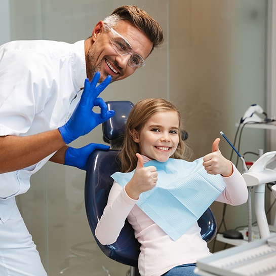 Man looking at his tooth-colored fillings in Weatherford, TX