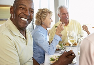 Group of people enjoying benefits of dental implants in Weatherford