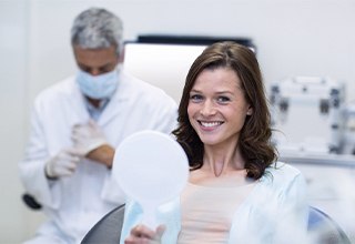 Woman visiting implant dentist in Weatherford for dental implant consultation