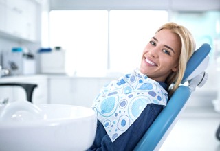 Woman leaning back in her chair after getting dental implants in Weatherford, TX