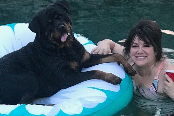 Alisa and her dog in the pool