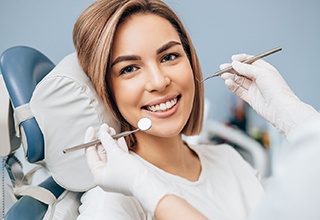 Happy patient attending checkup with her dentist in Weatherford