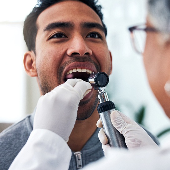 Man having his mouth checked