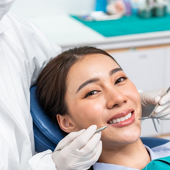 Woman smiling in the dental chair