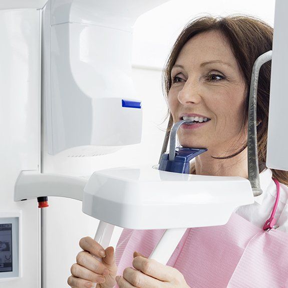 Woman receiving 3 D C T cone beam x-rays