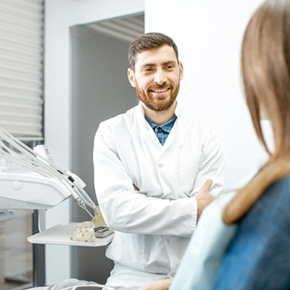 a patient chatting with their dentist