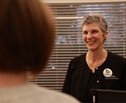 Dental team member smiling at patient in Weatherford dental office