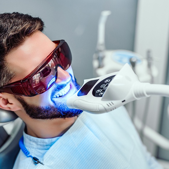 A patient receiving teeth whitening in Weatherford, TX