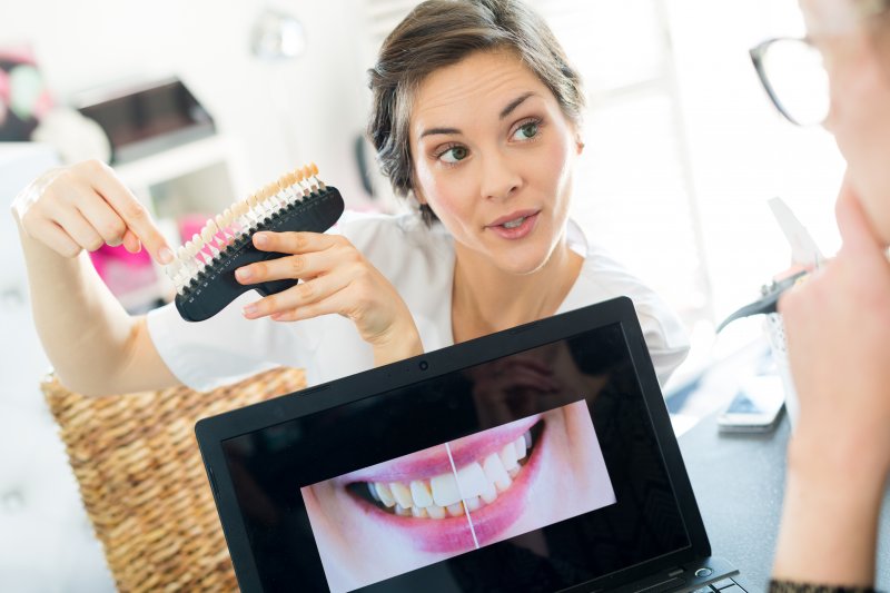 dentist explaining porcelain veneers to patient