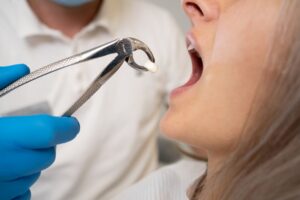Woman getting a tooth pulled